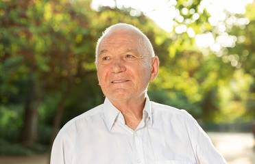 Portrait of elderly man in park
