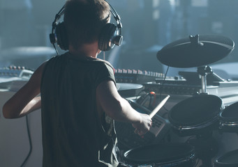 boy playing drums