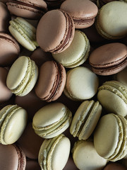 Heap of macaroons with natural colors of cocoa and matcha