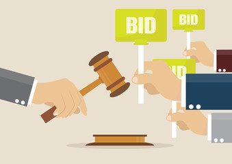 Hand holding auction paddle.