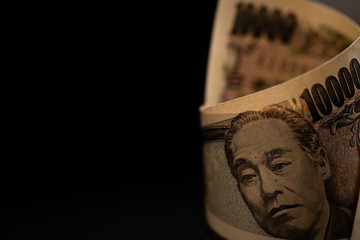 Roll of 10000 Japanese yen bill