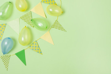 Birthday decoration on green background with copy space