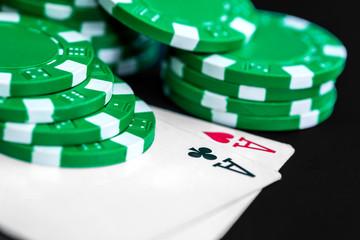 Poker chips and card on table