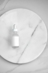 Fototapeta premium Bottle of whey on white marble