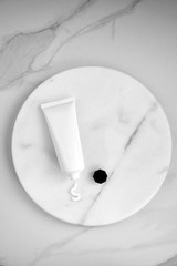 Tube of cream on marble surface