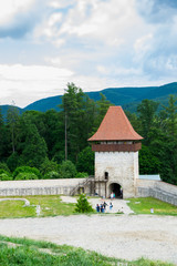 Fototapeta na wymiar Rasnov, Brasov, Romania - June 15, 2019: The Rasnov Fortress entrance tower.