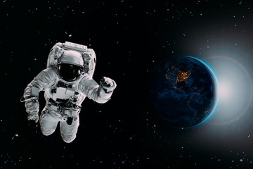 Obraz na płótnie Canvas astronaut flies over the earth in space. Elements of this image furnished by NASA