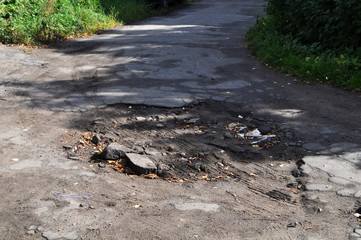 large pits with asphalt.