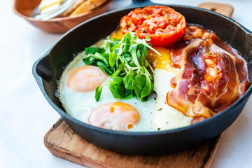 classical english breakfast with egg and ham