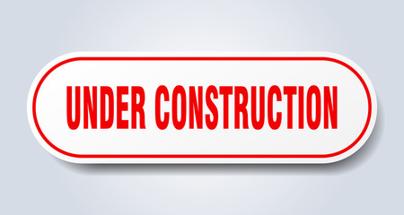 under construction sign. under construction rounded red sticker. under construction