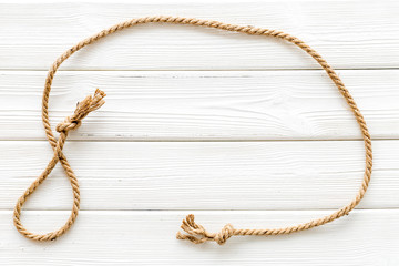 rope frame on white wooden background top view mock up