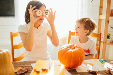 family of mother and children decorate the home for Halloween Happy Halloween concept