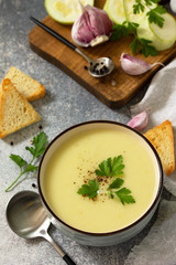 Vegetarian dish. Dietary Tasty Summer cream soup Zucchini on a light background.