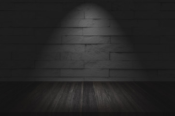 empty room with brick wall and wooden floor