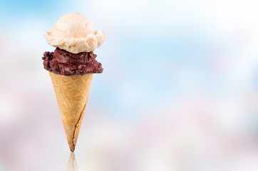 Tasty ,sweet Ice Cream  in the cone on background
