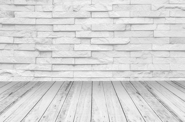 white brick wall and wooden floor