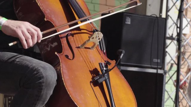 Man playing a double bass during a performance