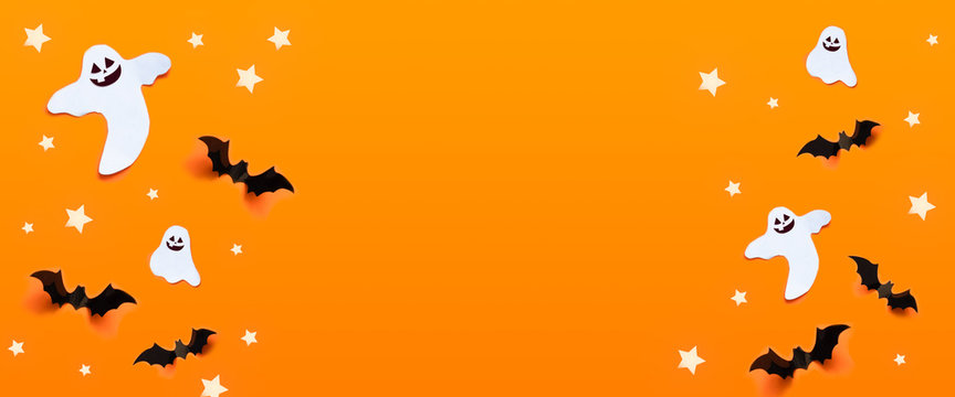 Autumn holiday composition. Halloween celebration concept with bats, ghost, spider web, stars