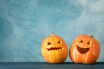 Halloween pumpkins on wooden background. Space for text