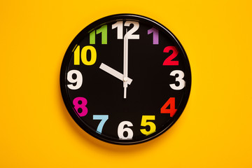 colorful wall clock show ten o'clock