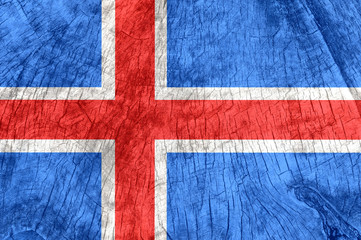 Iceland flag on an old wooden surface.