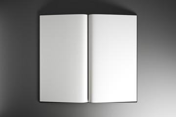 Open book with blank white mock up sheets at grey background.