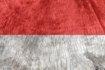 Monaco flag on an old wooden surface.