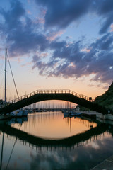Beautiful view on bridge in the harbor  at sunset, Sardinia, Italy
