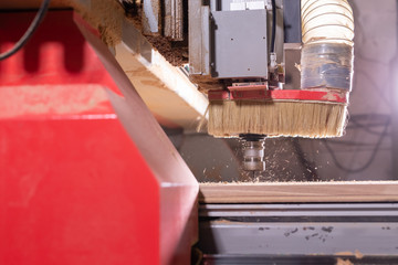wood, metal, production concept - the cutting instrument, focus at the cutting process