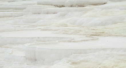 Natural Carbonate mineral travertine pools and terraces in Pamukkale.
