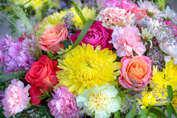 different flowers, dahlia yellow, chrysanthemums, roses in a bouquet