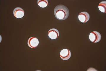 Dome of the Hammam with day light filtering through the ceiling closeup.