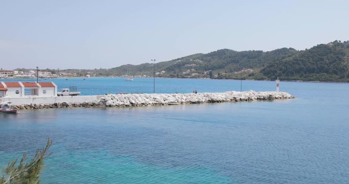 rocky pier in skiathos bay