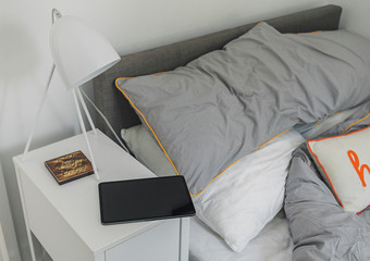 Tablet Computer next to bed