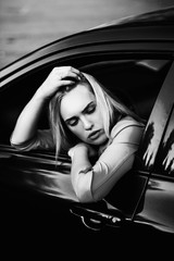 Fototapeta na wymiar young woman in a car