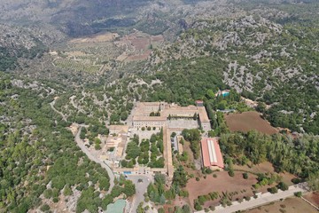 Fototapeta premium lluch Monastery famous places Mallorca island antique buldings ancient architecture aerial photography drone mountain green nature panoramic view landscape wallpaper beutiful colours 
