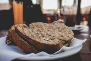 toasted bread placed on a plate at the terrace