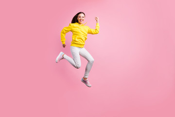 Fototapeta na wymiar Full length body size photo of beautiful charming attractive cute girlfriend wearing yellow sweater running quickly towards something while isolated with pink pastel color background