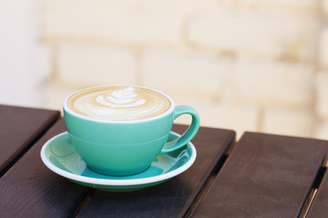 Coffee cup on wooden table. View from top. Copy space.