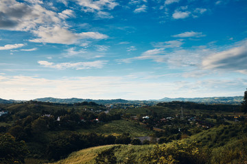 Fototapeta premium Mountain and forest with cloudy sky in Phetchabun, Thailand.