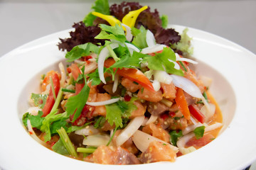  spicy salmon Thai salad on white plate