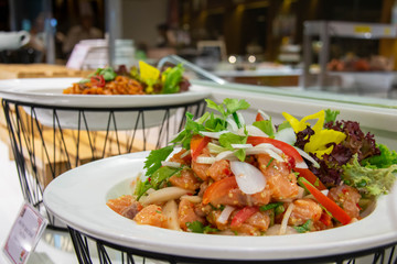  spicy salmon Thai salad on white plate