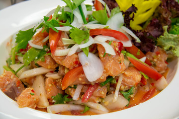  spicy salmon Thai salad on white plate