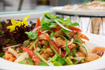  spicy salmon Thai salad on white plate