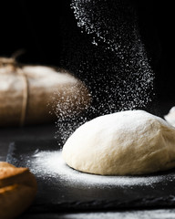 Close-up view of dough on black background