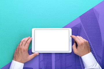 Man holds a tablet and looks at the screen. Mobile development. Innovational online businesses. Internet technologies. Trendy design. Geometry. Fashionable vibrant colors. Using a device. UX and UI.