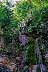 Waterfall from ravine.waterfall from the mountain river. rapid current
