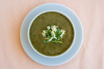 Green cream soup from spinach, close up