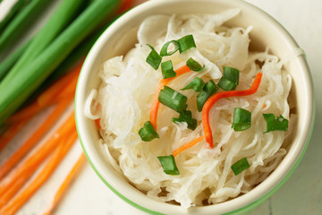 Sauerkraut salad in bowl, cabbage, onion, carrot