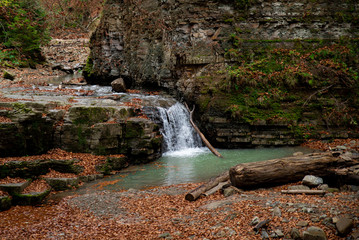 Fototapeta na wymiar view of waterfall in autumn forest